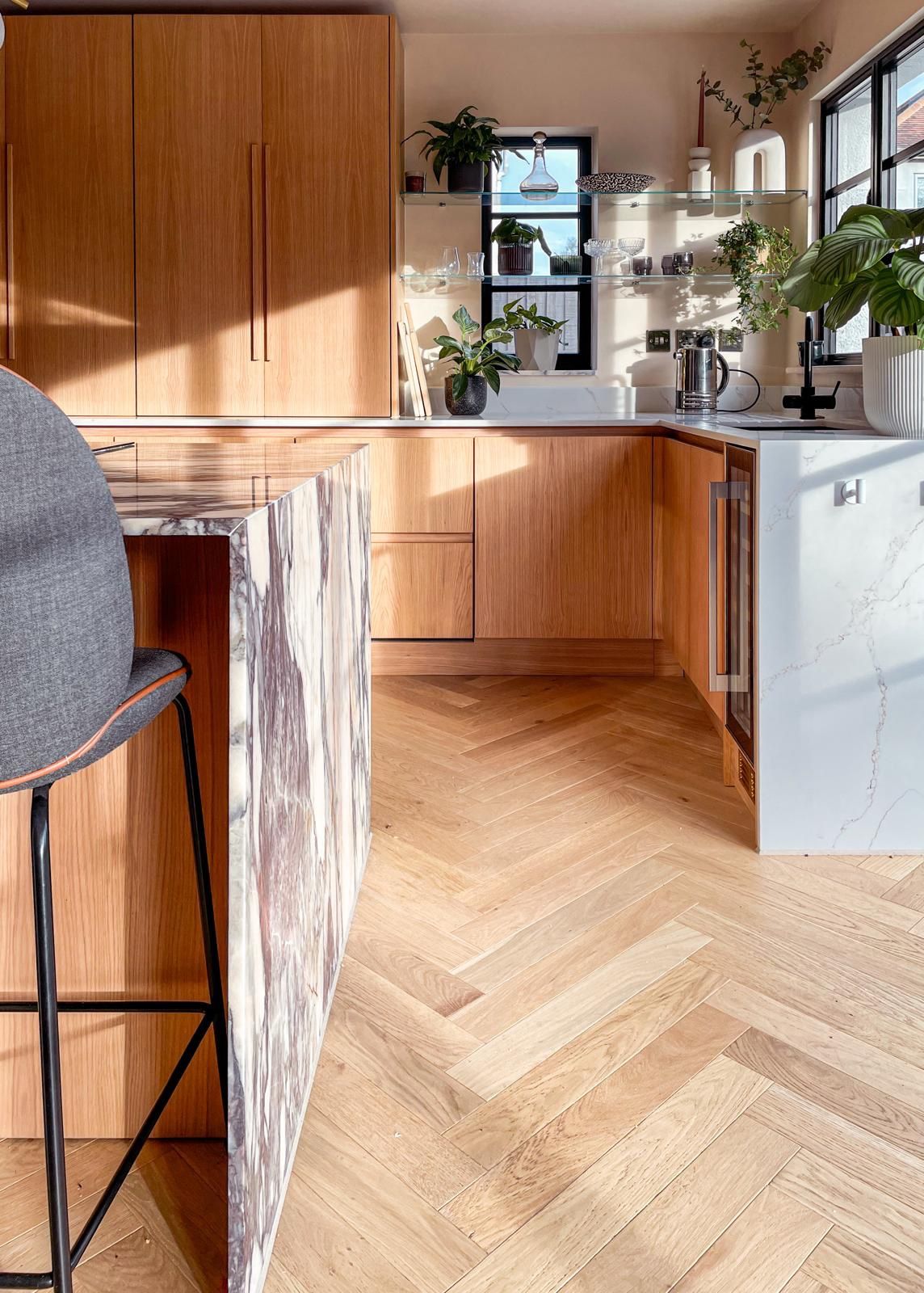 Marble waterfall island in a remodelled kitchen, Kent