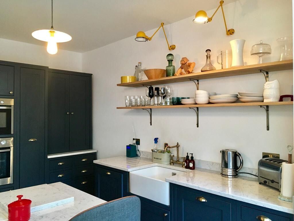 Deep blue kitchen with open shelving – London townhouse extension and remodel